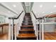 Elegant staircase with dark wood steps and white balusters at 2166 Tanglewood Dr, Snellville, GA 30078
