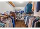 Walk-in closet featuring custom shelving and ample storage space for clothes, shoes, and accessories at 2166 Tanglewood Dr, Snellville, GA 30078