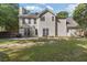 Spacious backyard with a patio, outdoor dining set, and a partial view of fencing at 2505 Hamilton Parc Ln, Buford, GA 30519