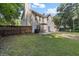 Grassy backyard featuring an outdoor dining set and a wood privacy fence at 2505 Hamilton Parc Ln, Buford, GA 30519