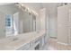 Bright bathroom with double sinks, tiled floors, a soaking tub and a separate tiled shower at 2505 Hamilton Parc Ln, Buford, GA 30519