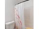 This bathroom offers a clean and functional space featuring a shower with patterned curtain at 2505 Hamilton Parc Ln, Buford, GA 30519