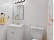Bright bathroom featuring a sink, toilet, vanity, and ample lighting at 2505 Hamilton Parc Ln, Buford, GA 30519