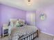 Calming lavender-painted bedroom with carpet and closet at 2505 Hamilton Parc Ln, Buford, GA 30519
