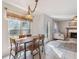 Charming dining area features a table, bright window, and is adjacent to the living room at 2505 Hamilton Parc Ln, Buford, GA 30519