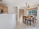 Eat-in kitchen with a table and chairs, ample sunlight, and view of the kitchen at 2505 Hamilton Parc Ln, Buford, GA 30519