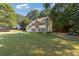 Well-maintained two-story home with an attached two-car garage and a large lawn at 2505 Hamilton Parc Ln, Buford, GA 30519