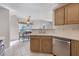 Open-concept kitchen with bright countertops and stainless steel appliances at 2505 Hamilton Parc Ln, Buford, GA 30519