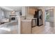 Partial view of the kitchen shows stainless steel appliances and breakfast bar at 2505 Hamilton Parc Ln, Buford, GA 30519
