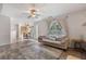 Inviting living room with hardwood floors, ceiling fan, and view into the dining area at 2505 Hamilton Parc Ln, Buford, GA 30519