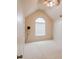 Bedroom with vaulted ceiling, large arched window, and a ceiling fan at 3019 Iona Ct, Snellville, GA 30039