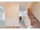 Inviting entryway features wood-look flooring, wainscoting, and staircase at 3019 Iona Ct, Snellville, GA 30039
