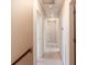 Well-lit hallway offering a glimpse of the home's layout and design, with white trim at 3019 Iona Ct, Snellville, GA 30039