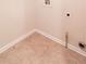 Laundry area showing tiled flooring and utility connections, ready for appliances at 3019 Iona Ct, Snellville, GA 30039