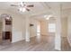 Open-concept space featuring wood-look floors, archways, and generous lighting at 3019 Iona Ct, Snellville, GA 30039