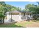 Fenced backyard with freshly painted one-story home and chain link fencing for added security at 3436 Adkins Nw Rd, Atlanta, GA 30331