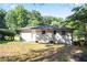 The home's backyard featuring a well-maintained lawn, landscaping, and fenced perimeter at 3436 Adkins Nw Rd, Atlanta, GA 30331