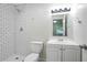Well-lit bathroom featuring subway tile shower and a white vanity at 3436 Adkins Nw Rd, Atlanta, GA 30331