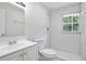 Bathroom features a white subway tile shower, modern fixtures, and a bright window at 3436 Adkins Nw Rd, Atlanta, GA 30331