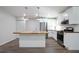 A modern kitchen featuring stainless steel appliances, a center island, and hardwood countertops at 3436 Adkins Nw Rd, Atlanta, GA 30331