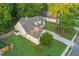 Aerial view of a home with a large, well-maintained backyard, fenced for privacy, and a detached garage at 114 Arborwood Way, Temple, GA 30179