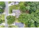 An aerial view of a residential neighborhood, showcasing the home's location among tree-lined streets at 114 Arborwood Way, Temple, GA 30179