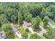 An aerial shot showing a charming home nestled in a lush, green neighborhood at 114 Arborwood Way, Temple, GA 30179