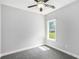 Cozy bedroom featuring neutral paint, carpeted floors, a ceiling fan, and natural light at 114 Arborwood Way, Temple, GA 30179