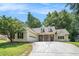 Single-story home with a two-car garage, manicured lawn, and inviting stone-accented entryway at 114 Arborwood Way, Temple, GA 30179