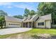 Charming single-story home featuring a stone-accented entrance and a spacious two-car garage at 114 Arborwood Way, Temple, GA 30179