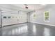 Spacious two car garage with a sealed floor and insulated doors, brightened by two windows at 114 Arborwood Way, Temple, GA 30179