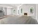 Bright living room boasting vaulted ceilings, a cozy fireplace, and a mix of carpet and hardwood flooring at 114 Arborwood Way, Temple, GA 30179