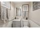 Stylish half bathroom with modern fixtures, updated vanity, and decorative accents at 1651 King Rd, Riverdale, GA 30296