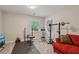 Bright exercise room featuring carpet, natural light, and exercise equipment at 1651 King Rd, Riverdale, GA 30296