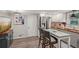 Bright and spacious kitchen includes stainless steel appliances, custom cabinets, island with seating, and adjacent breakfast area at 1651 King Rd, Riverdale, GA 30296