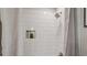 Shower with contemporary shower-head, tiled walls, and a convenient niche at 1651 King Rd, Riverdale, GA 30296