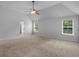 Expansive primary bedroom offering natural light, fan, carpet, and ensuite bathroom at 149 Elkins Blvd, Locust Grove, GA 30248