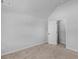 Bedroom featuring carpet, a vaulted ceiling, a closet, and white paint at 149 Elkins Blvd, Locust Grove, GA 30248