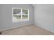 A bright bedroom with a window providing ample light and outdoor view at 149 Elkins Blvd, Locust Grove, GA 30248