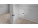Open door leads to a carpeted closet with built-in shelving for organized storage at 149 Elkins Blvd, Locust Grove, GA 30248