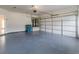 A two-car garage featuring an epoxy floor at 149 Elkins Blvd, Locust Grove, GA 30248