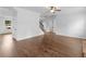 Open-concept living space with hardwood floors and stairs leading to a second floor at 149 Elkins Blvd, Locust Grove, GA 30248