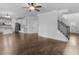 Open floor plan with hardwood floors leading to staircase, entry, and kitchen at 149 Elkins Blvd, Locust Grove, GA 30248