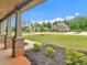 Inviting covered porch with brick-based columns and views of the landscaped front yard at 149 Elkins Blvd, Locust Grove, GA 30248
