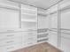 A walk-in closet with custom shelving and drawer organization at 149 Elkins Blvd, Locust Grove, GA 30248