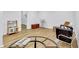 Bright and open basement area featuring wood floors and neutral walls at 11739 Sawgrass Ct, Fayetteville, GA 30215
