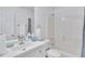 Clean bathroom with tile floors, shower and tub combo, and a large vanity at 11739 Sawgrass Ct, Fayetteville, GA 30215