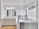 Bright bathroom featuring double vanity, soaking tub, and glass enclosed shower at 11739 Sawgrass Ct, Fayetteville, GA 30215