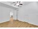 Bedroom featuring light brown floors, closet, and neutral walls at 11739 Sawgrass Ct, Fayetteville, GA 30215