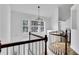 Upstairs foyer area featuring cathedral ceiling and lots of natural light at 11739 Sawgrass Ct, Fayetteville, GA 30215